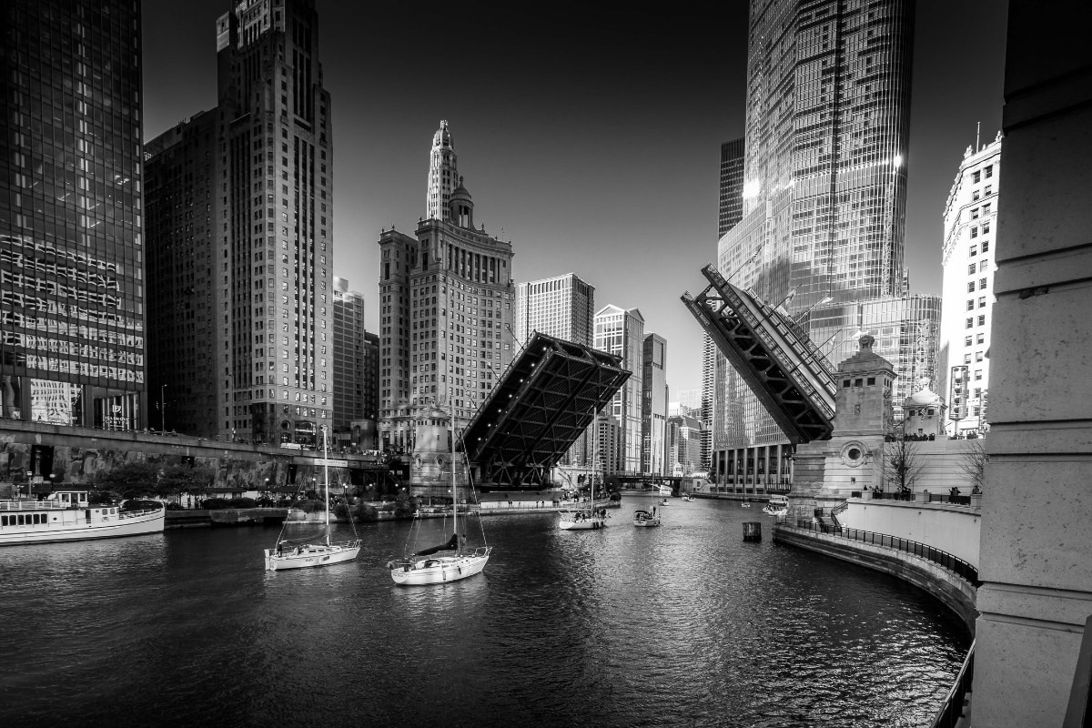 Chicago River with drawbridges raised, downtown skyline behind — HBM Engineering's home territory