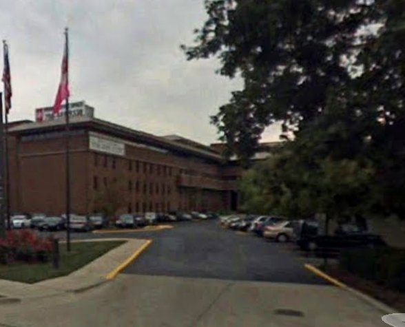 The HBM Engineering headquarters building with the U.S. and Illinois flags out front.