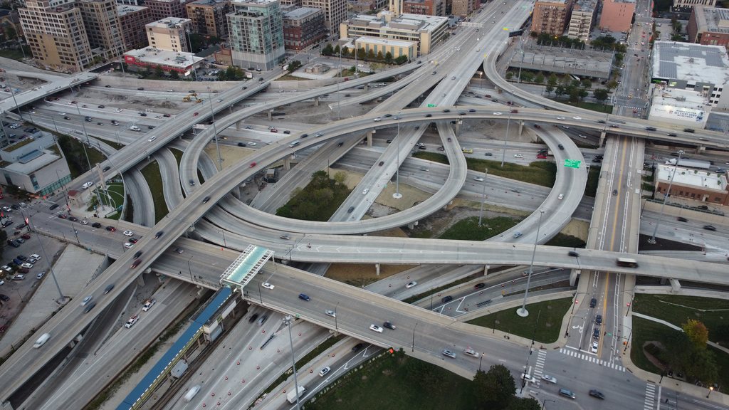 Aerial view of a major highway interchange with multiple ramps and overpasses.